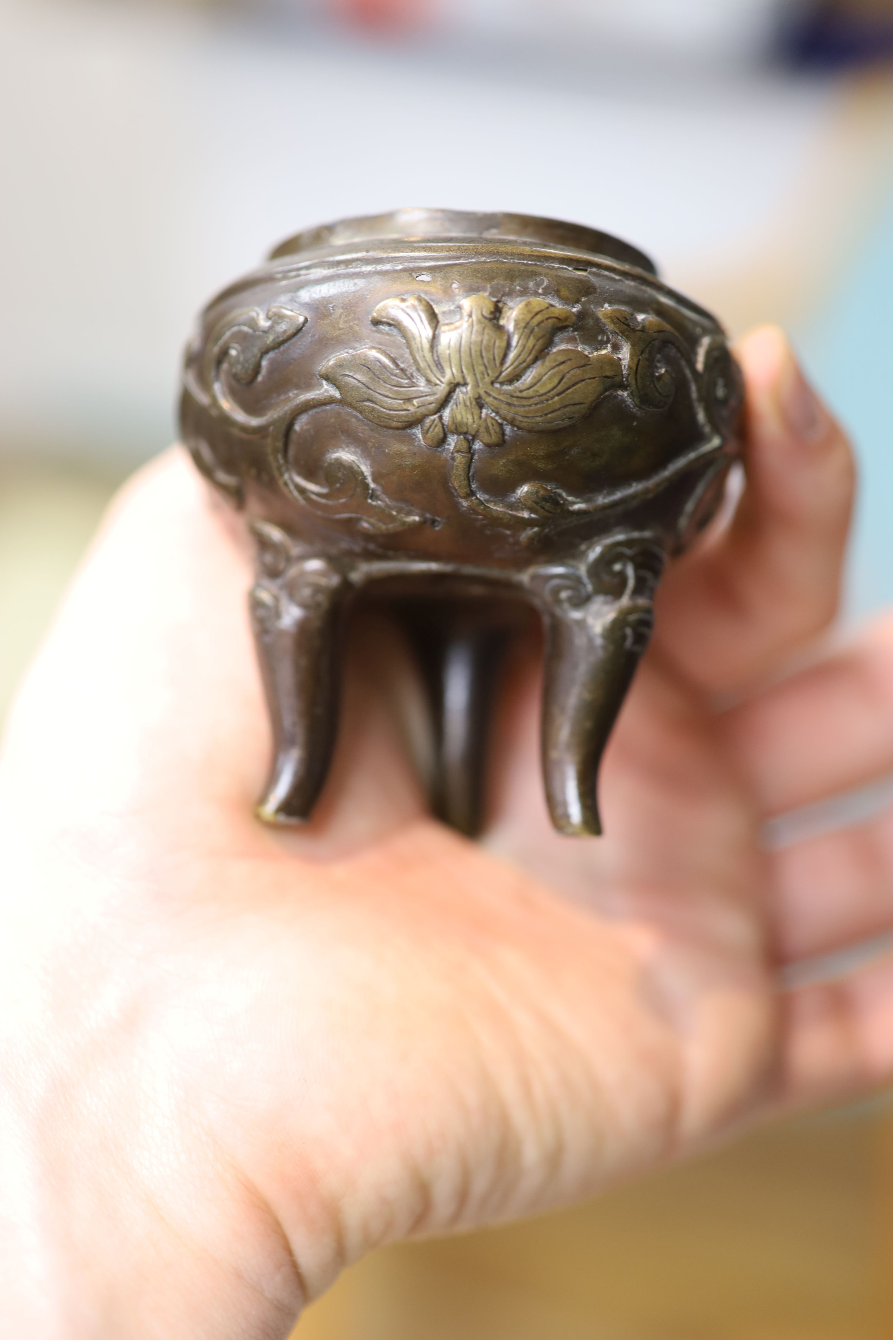 A bronze deity, height 17cm, a Chinese dragon bowl, a censer, etc.